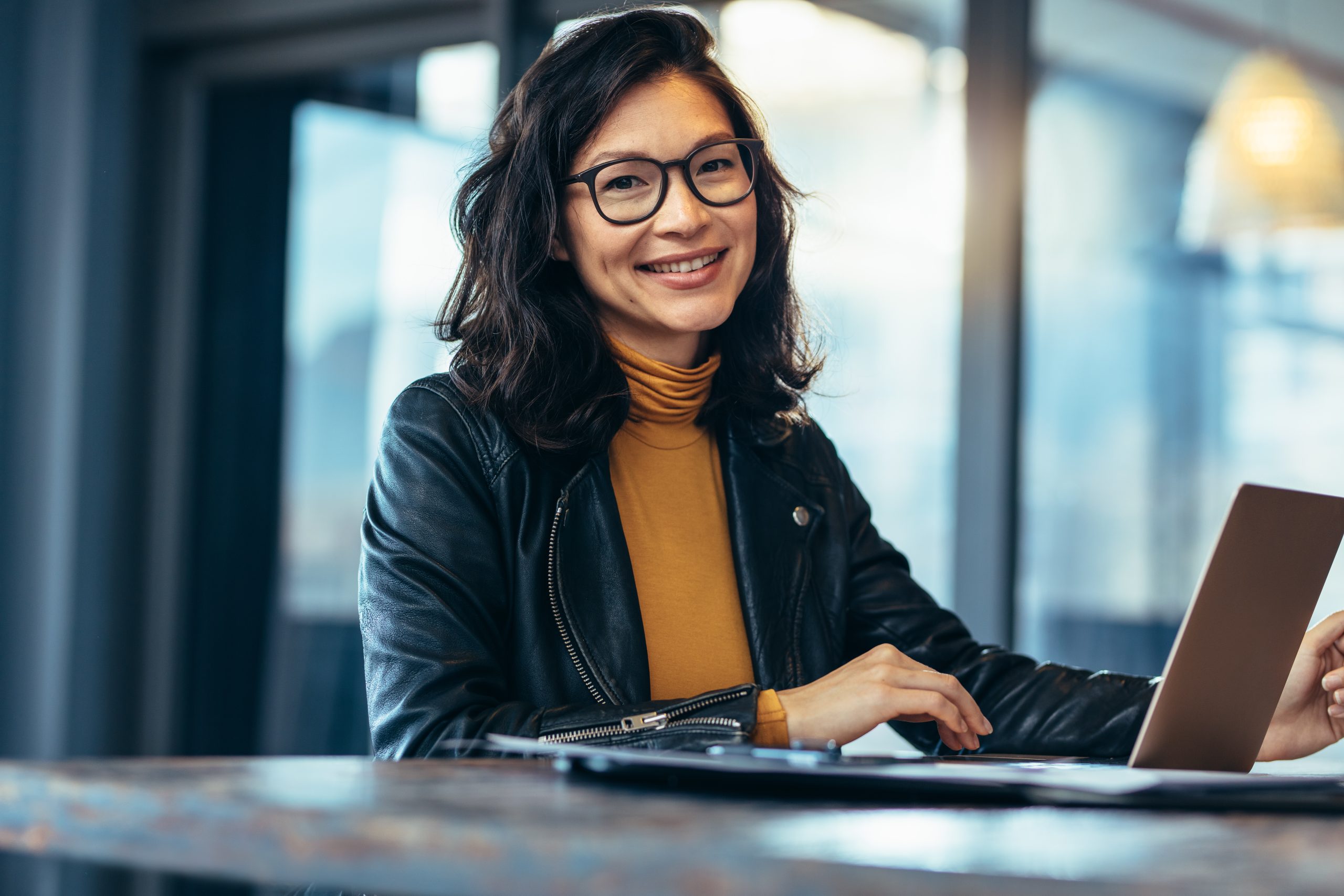 Smiling business woman in casuals at office Smiling business woman in casuals at office